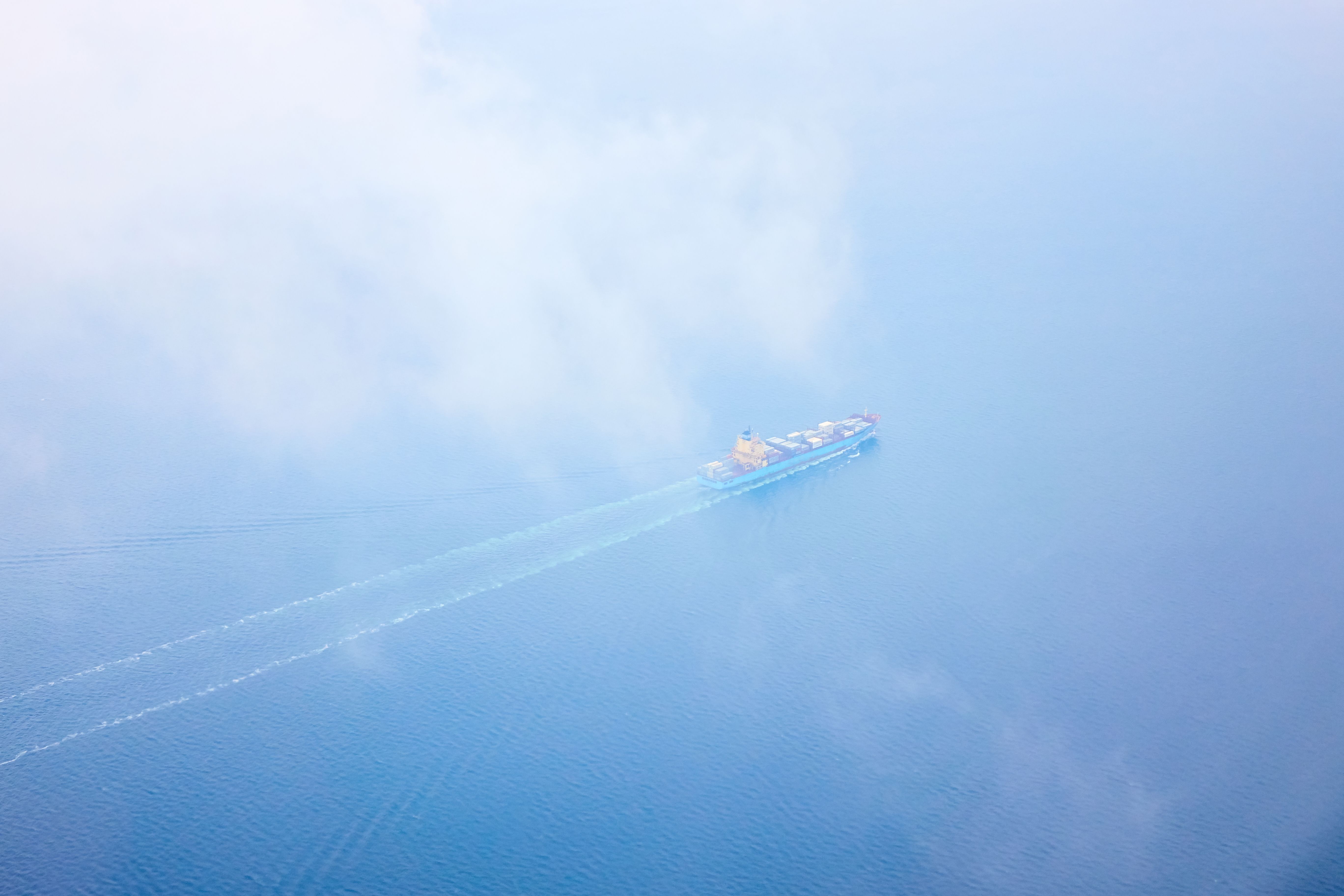 aerial-view-sea-with-passing-cargo-ship (1).jpg